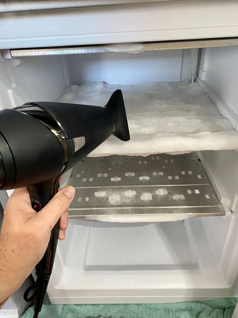 use hair dryer for defrosting a freezer